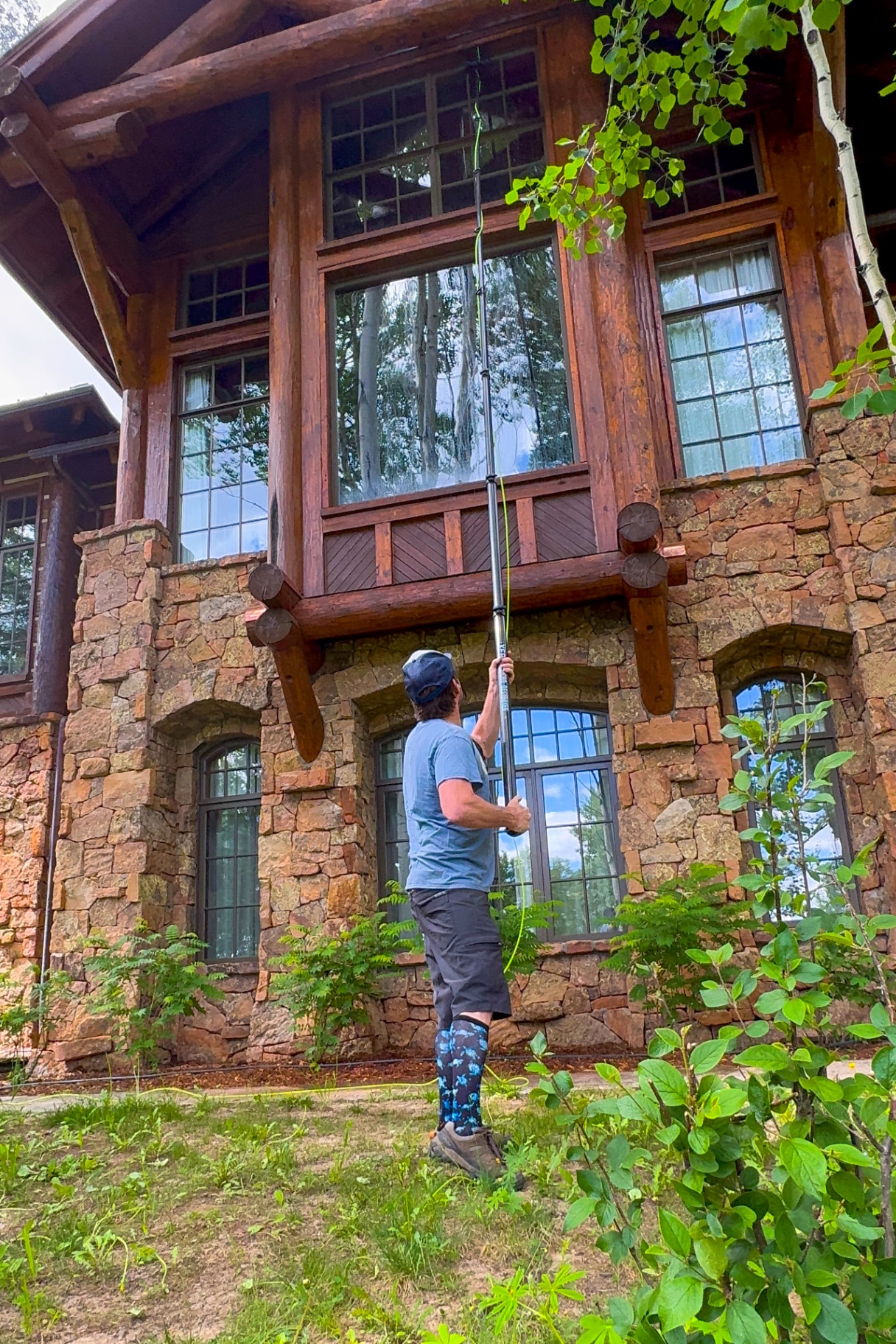 Residential window cleaning on the vaulted windows of a mountain home in Bachelor Gulch, Colorado